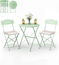 Set bistrot pieghevole da balcone con due sedie e tavolo traforato con cuscini verde chiaro